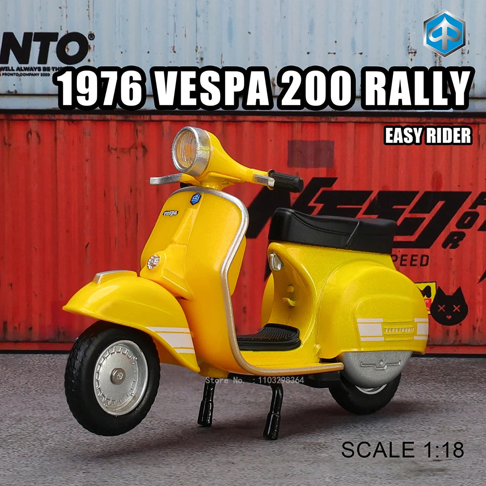 A yellow 1976 Vespa 200 rally die-cast model is displayed on a gray surface.