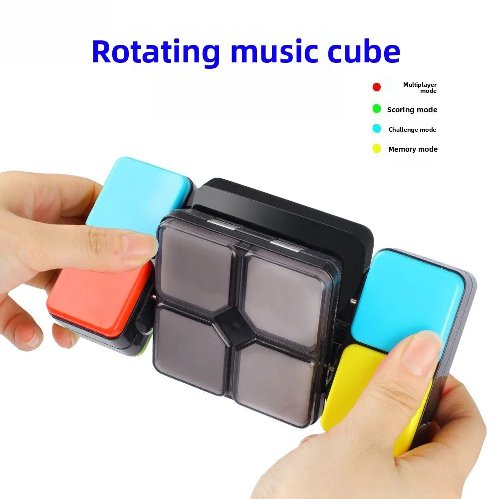 A hand holds a rotating music cube with multiple colored segments and various modes.