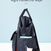 A navy blue waterproof diaper backpack featuring a right pocket for wipes and a changing mat.