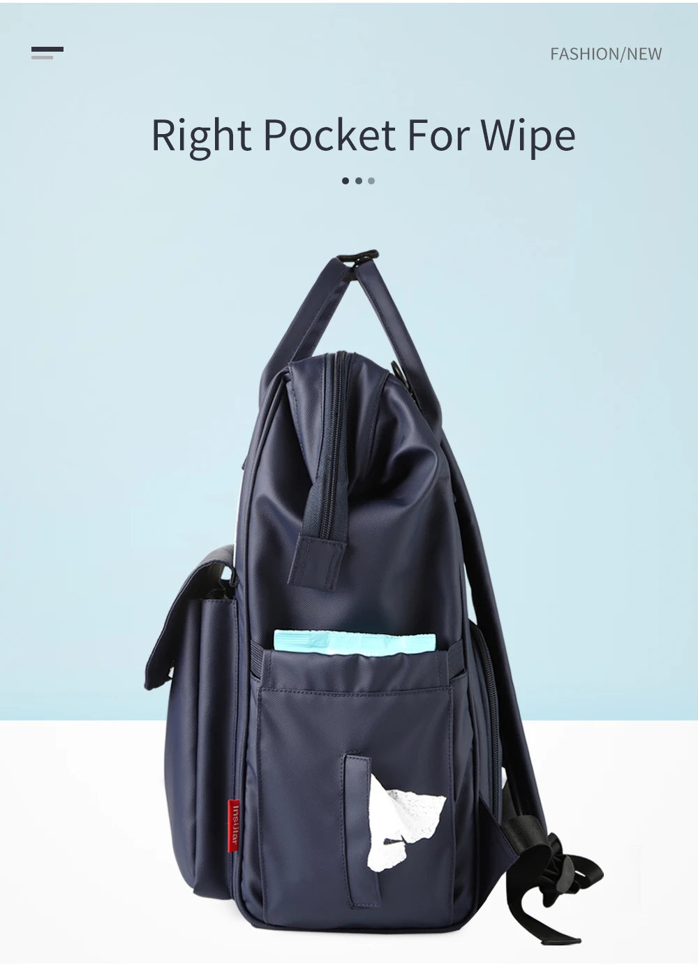 A navy blue waterproof diaper backpack featuring a right pocket for wipes and a changing mat.