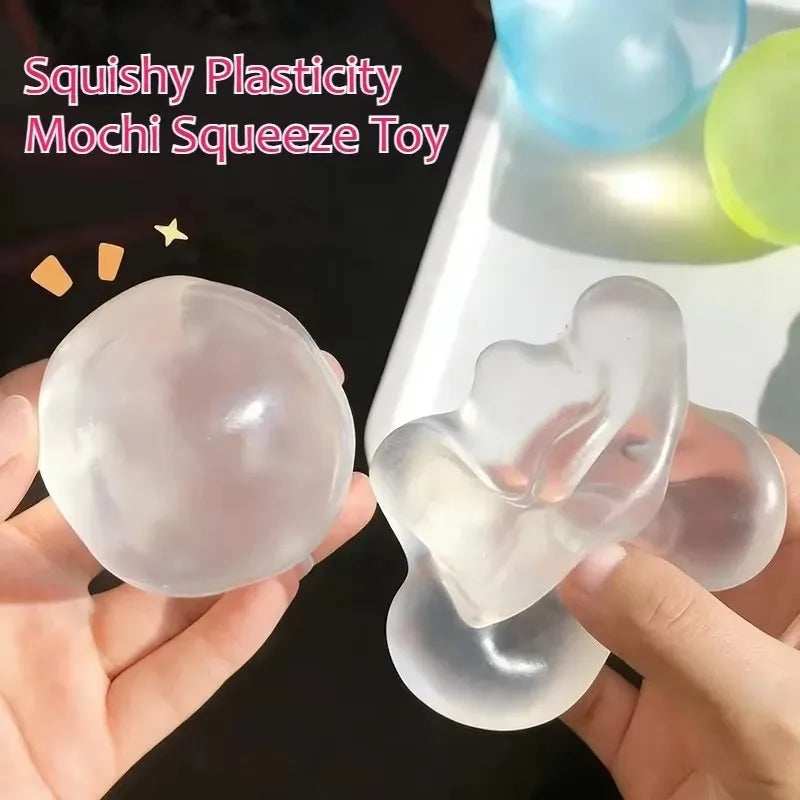 A hand holds a translucent pink squishy stress ball with a soft, slow-rising texture.