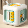 A white and light blue electronic cube toy for toddlers with a handle and multiple colored stacking blocks.