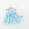 A light blue floral print baby girl summer dress with a bow and a matching white sunhat