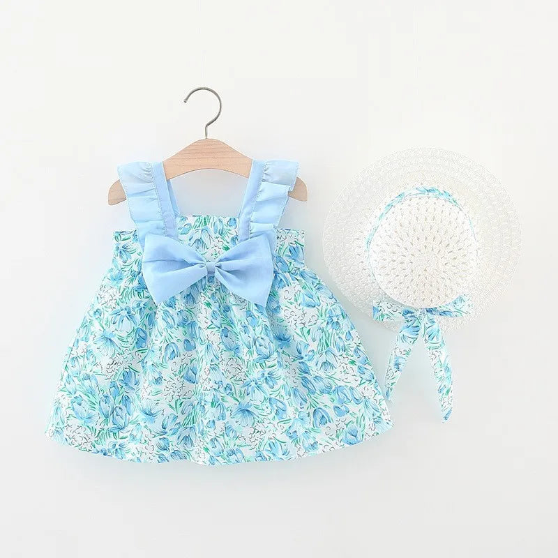 A light blue floral print baby girl summer dress with a bow and a matching white sunhat