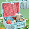 A light blue picnic basket with a red checkered lid is shown, filled with pretend food and tea items.