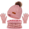 A set of women's knit winter hat, scarf, and gloves in pink with a faux fur pom.