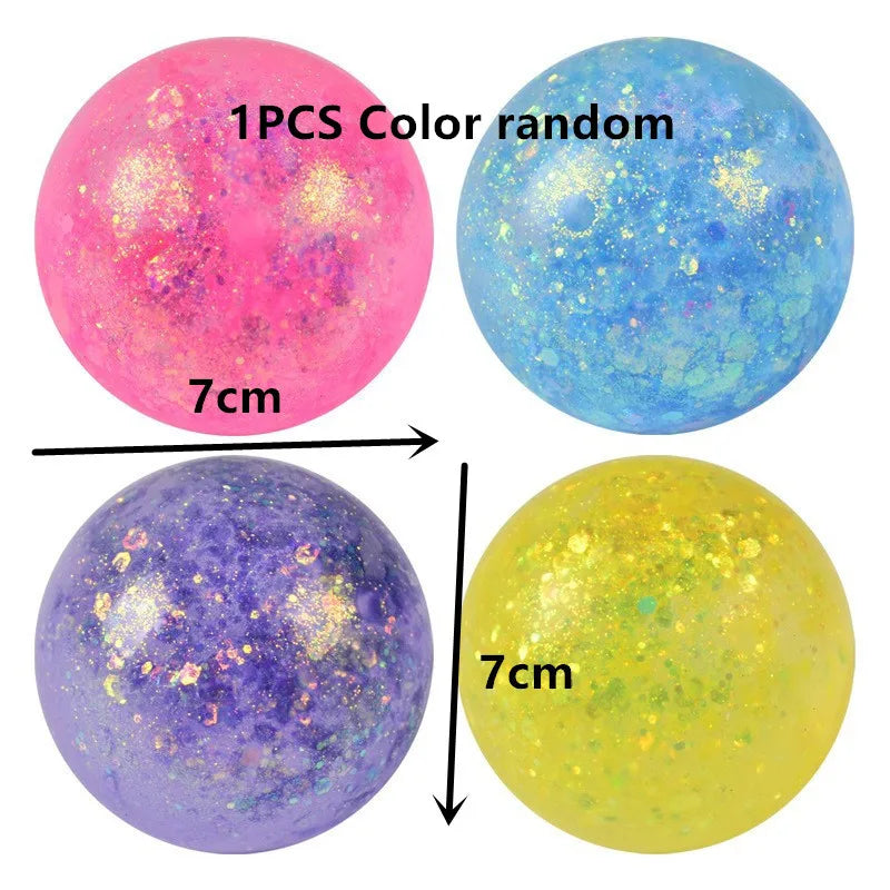 Three colorful spheres of varying colors including pink blue and yellow showing different light effects