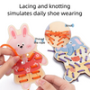 A hand is lacing a wooden rabbit toy with orange thread and rope to simulate daily shoe wearing.
