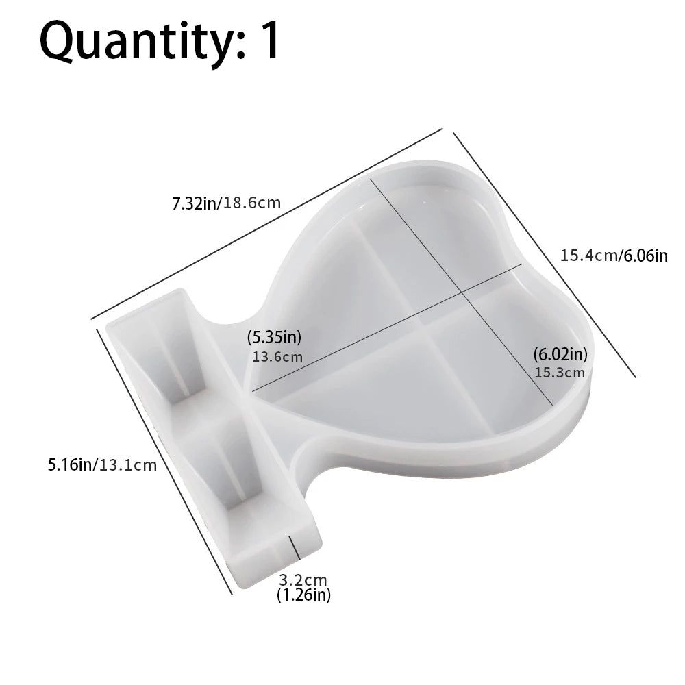 A white silicone mold for resin casting shaped like a heart with various dimensions marked.