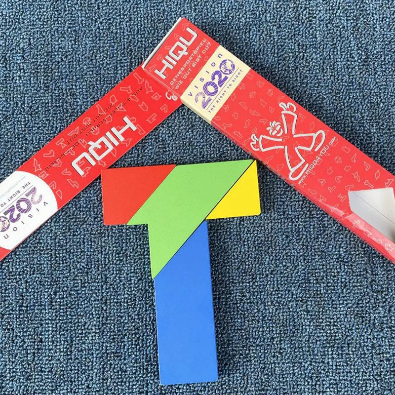 A wooden tangram puzzle featuring geometric shapes in red, green, yellow, and blue.