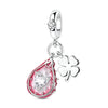 A silver fruit charm bead featuring a pink and white teardrop shape with a clear heart-shaped gemstone.