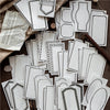 A collection of vintage scrapbooking paper sheets in white and gray patterns for journaling and crafts.