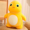 A bright yellow, smiling dinosaur plush toy with a white belly sitting on a woven surface.