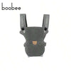 A gray ergonomic 4-in-1 baby carrier with adjustable straps.