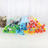 A collection of 50 silicone soap and candle molds in various colors and shapes laid out on a white surface.