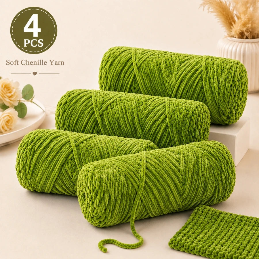 Four balls of bright green soft chenille yarn for crochet and knitting projects.