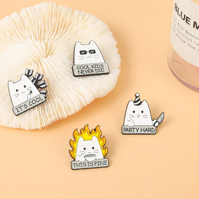 A set of four black cat enamel pins featuring various expressions and phrases like Cool Kids Never Die, It's Cool, Party Hard