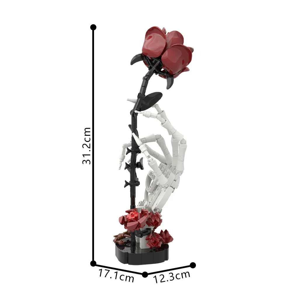 A building kit of a skeleton hand with a red rose bouquet on its hand.