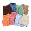 A collection of cozy lamb wool baby vests in various shades including blue, green, brown, and orange.