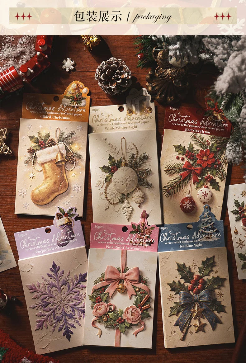 A collection of embossed Christmas advent cards and decorative paper sheets featuring winter themes and festive designs.
