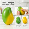 A green mango squishy stress ball changing color from emerald green to warm yellow.