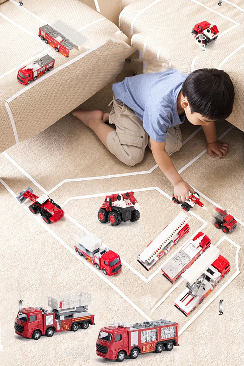 A child is playing with a die-cast fire fighting vehicle set featuring various trucks and a ladder truck on a carpeted floor.
