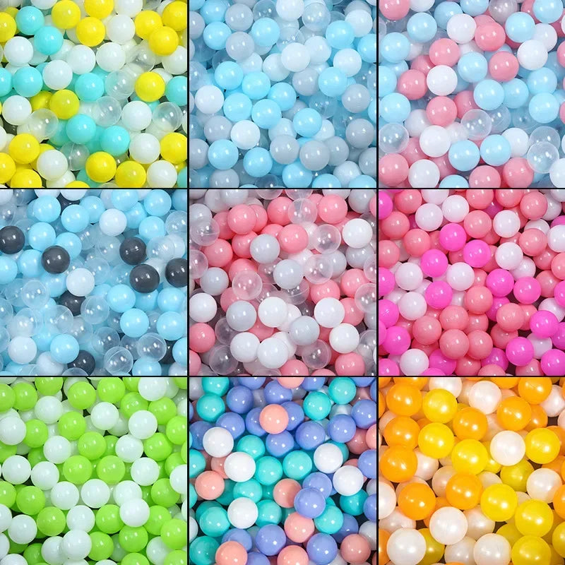 A collection of colorful plastic balls in various shades including blue, pink, yellow, and white.