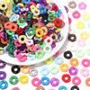 Assortment of colorful acrylic spacer beads in various shapes and colors