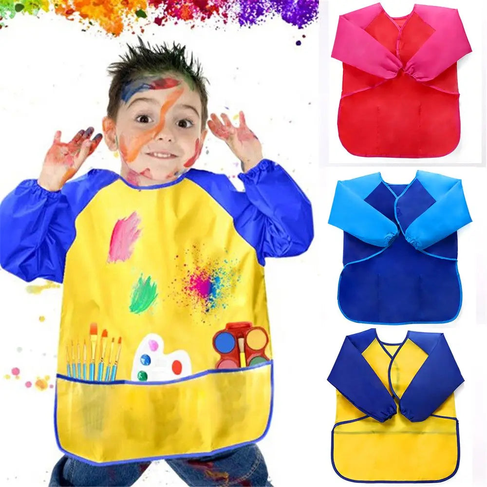 A child wearing a yellow waterproof art and baking apron with long sleeves, featuring colorful paint splatters.