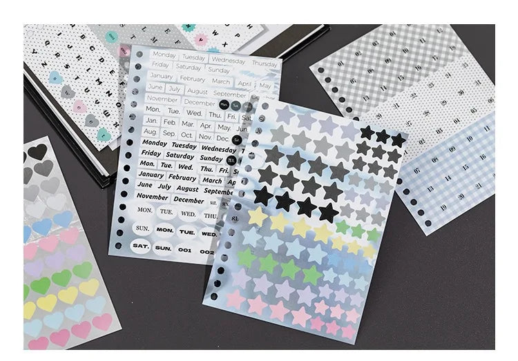 A collection of patterned stickers and photocards featuring various colors, stars, hearts, and calendar layouts for crafting.
