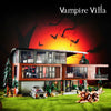 A model of a Vampire Villa building set featuring a multi-story house with dark accents and surrounding greenery.