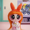 A collectible figure of Blossom from The Powerpuff Girls, featuring orange hair and pink clothing.