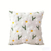 White faux fur pillow covers with embroidered green and yellow daisy flowers