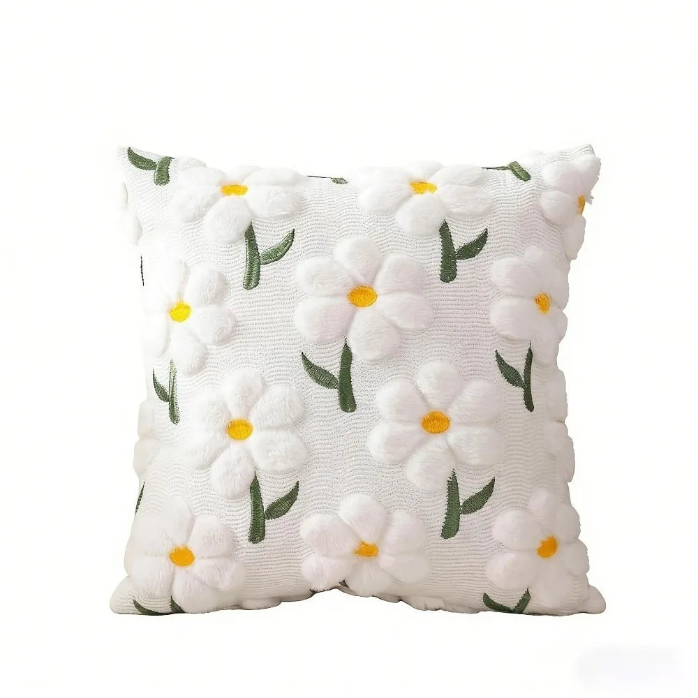 White faux fur pillow covers with embroidered green and yellow daisy flowers
