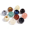 A collection of 10 translucent acrylic cloud beads in various shades of green, yellow, brown, and purple.
