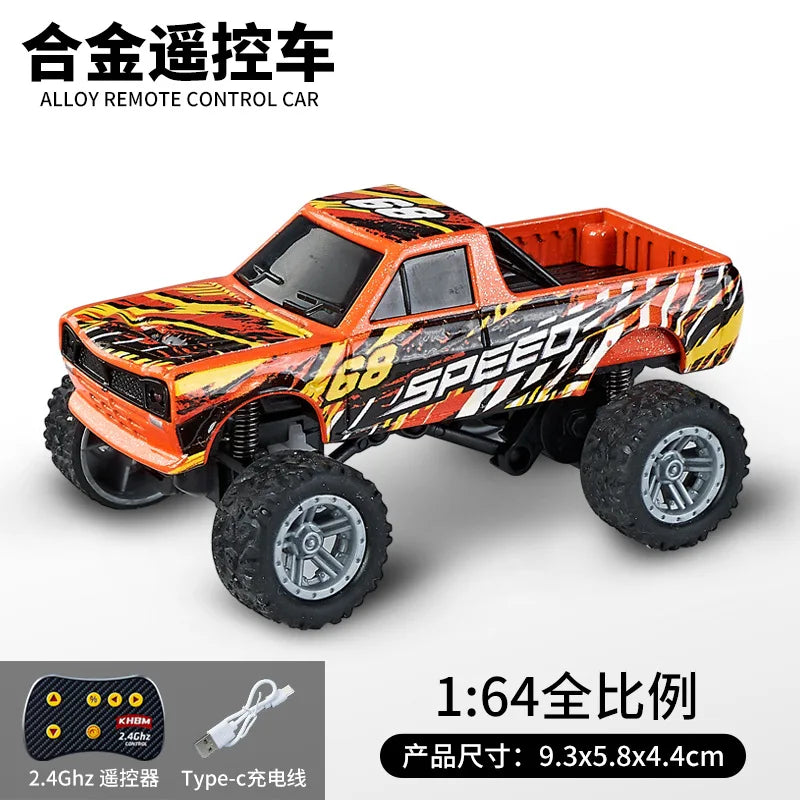 A bright orange and black 1:64 scale alloy remote control monster truck for off-road drifting.