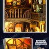 A close-up of a DIY wooden book nook kit featuring miniature figurines and detailed woodwork.