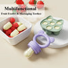A silicone baby fruit feeder set with freezer molds and a purple feeding tool is shown next to fresh strawberries.