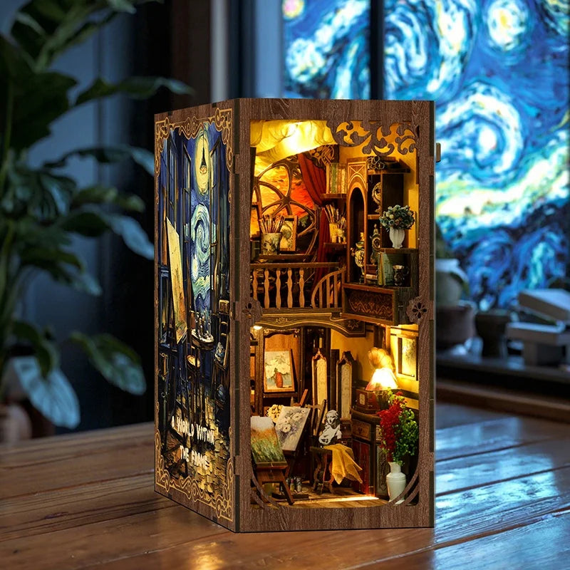 A wooden book nook kit featuring miniature figurines and detailed scenes inside a decorative box.