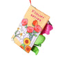 A soft sensory cloth book for babies featuring flowers and crinkle pages.