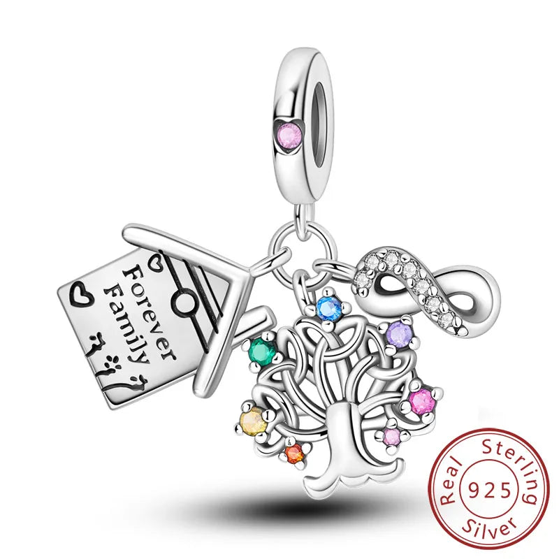 A sterling silver heart charm with a pendant engraved Forever Family.