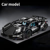 A black 1:14 scale RC sports car model with a spoiler and racing features displayed on a dark surface.