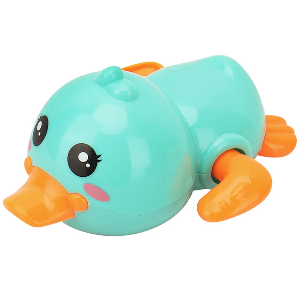A bright turquoise clockwork duck bath toy with orange accents.