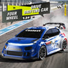 A blue 1:24 scale drift car is shown in a dynamic racing pose on an asphalt track.