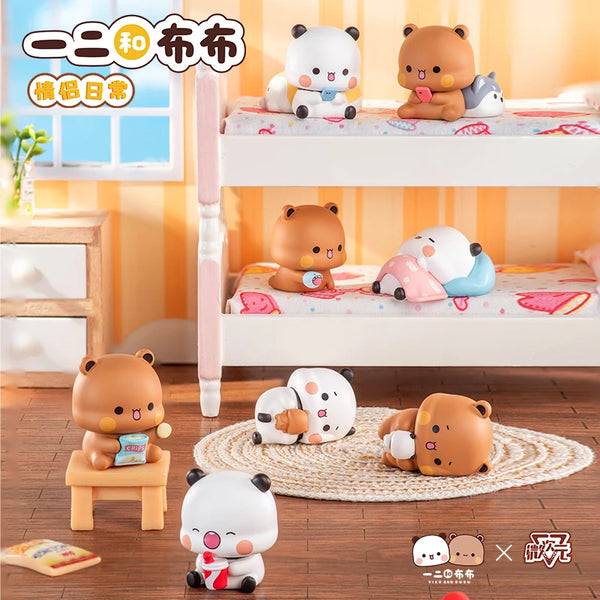 A collection of cute animal figurines, including bears and pandas, displayed on shelves and a wooden surface.