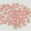 A pile of faceted pink crystal glass beads for jewelry making