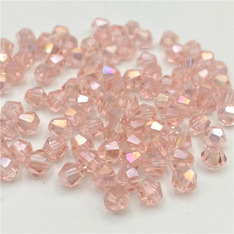 A pile of faceted pink crystal glass beads for jewelry making