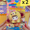 A plush doll from the Nommi Childhood series blind box collectible set shown in a box.
