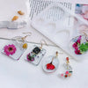 A collection of geometric silicone molds for epoxy resin earrings and pendants, featuring floral and natural shapes.