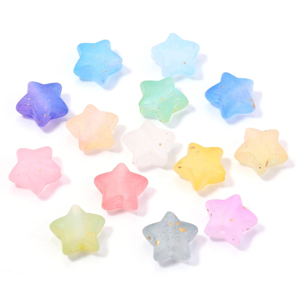 A collection of colorful transparent star acrylic beads in shades of blue, green, yellow, and pink scattered on a white backg